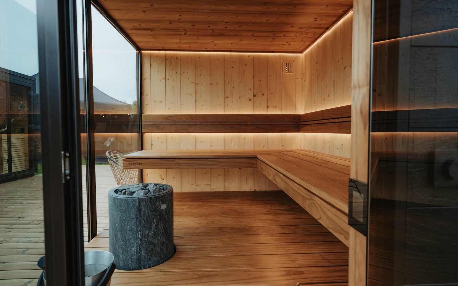 A contemporary backlit sauna suite